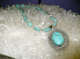Turqoise cabachon medallion pendant on turqoise beaded necklace